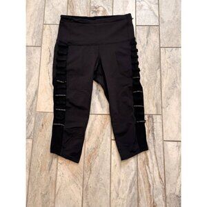 Lululemon women's size 6 black cropped leggings with reflective accents on sides